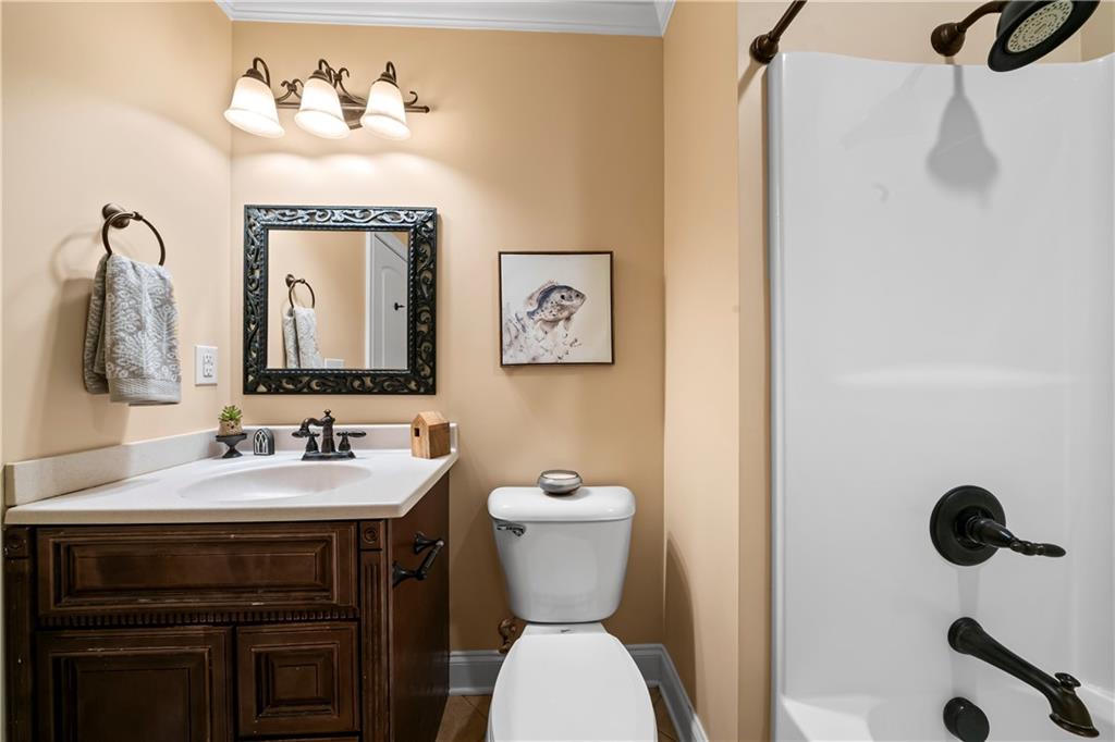 23 Walton Creek Drive Southwest Rome, GA 30165 - Photo 8 of 35 a bathroom with a toilet sink and mirror