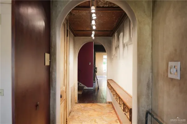 a view of wooden door with glass windows