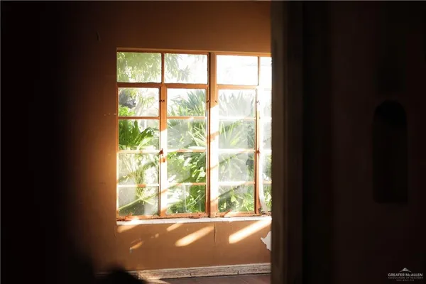 a bathroom with a granite countertop sink a mirror and shower