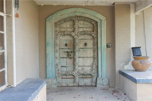 a view of a house with a yard and front door