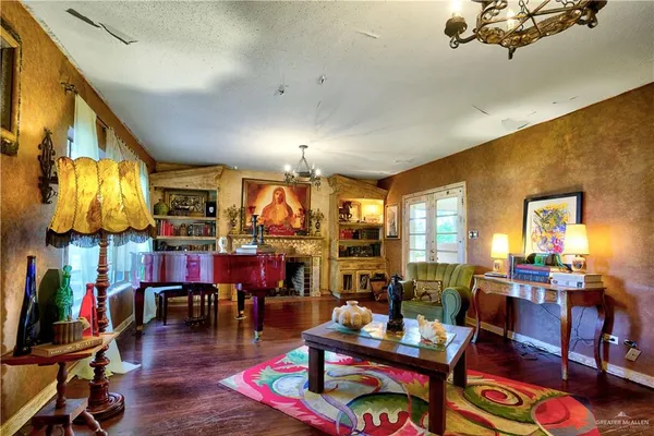 a living room filled with furniture and wooden floor