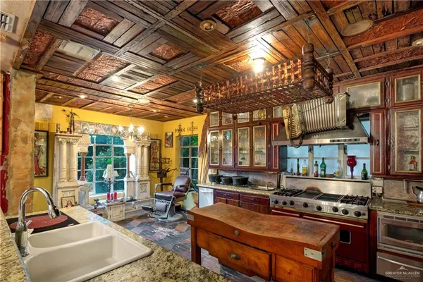 a living room with furniture a flat screen tv and windows