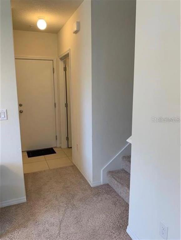 3740 Seneca Club Loop Orlando, FL 32808 - Photo 11 of 15 a view of hallway with shower