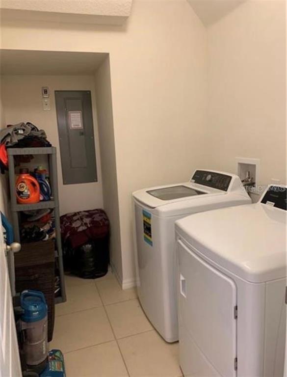 3740 Seneca Club Loop Orlando, FL 32808 - Photo 12 of 15 a utility room with dryer and washer