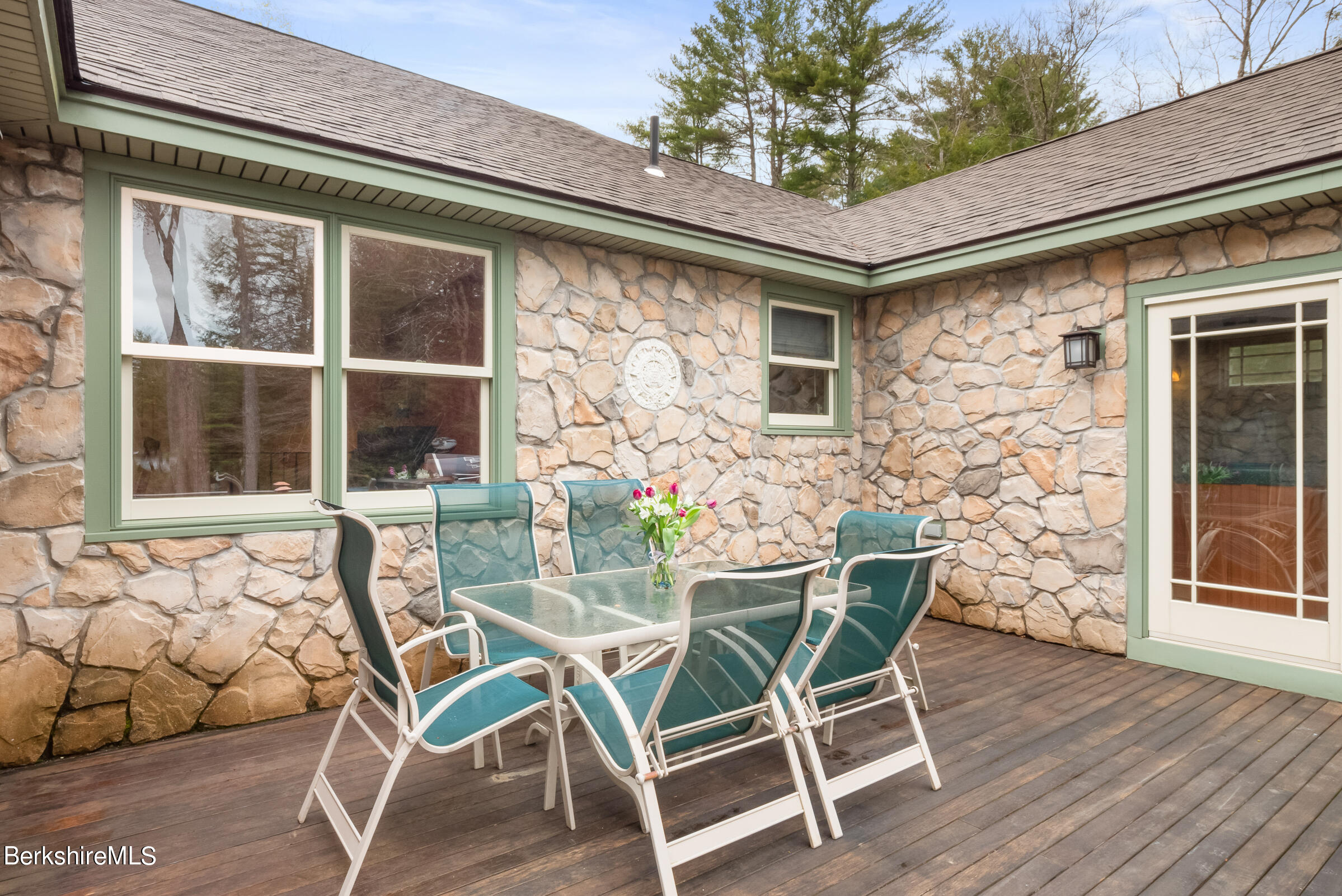 10 Antin Road Chesterfield, MA 01012 - Photo 30 of 36 a patio with table and chairs and potted plants