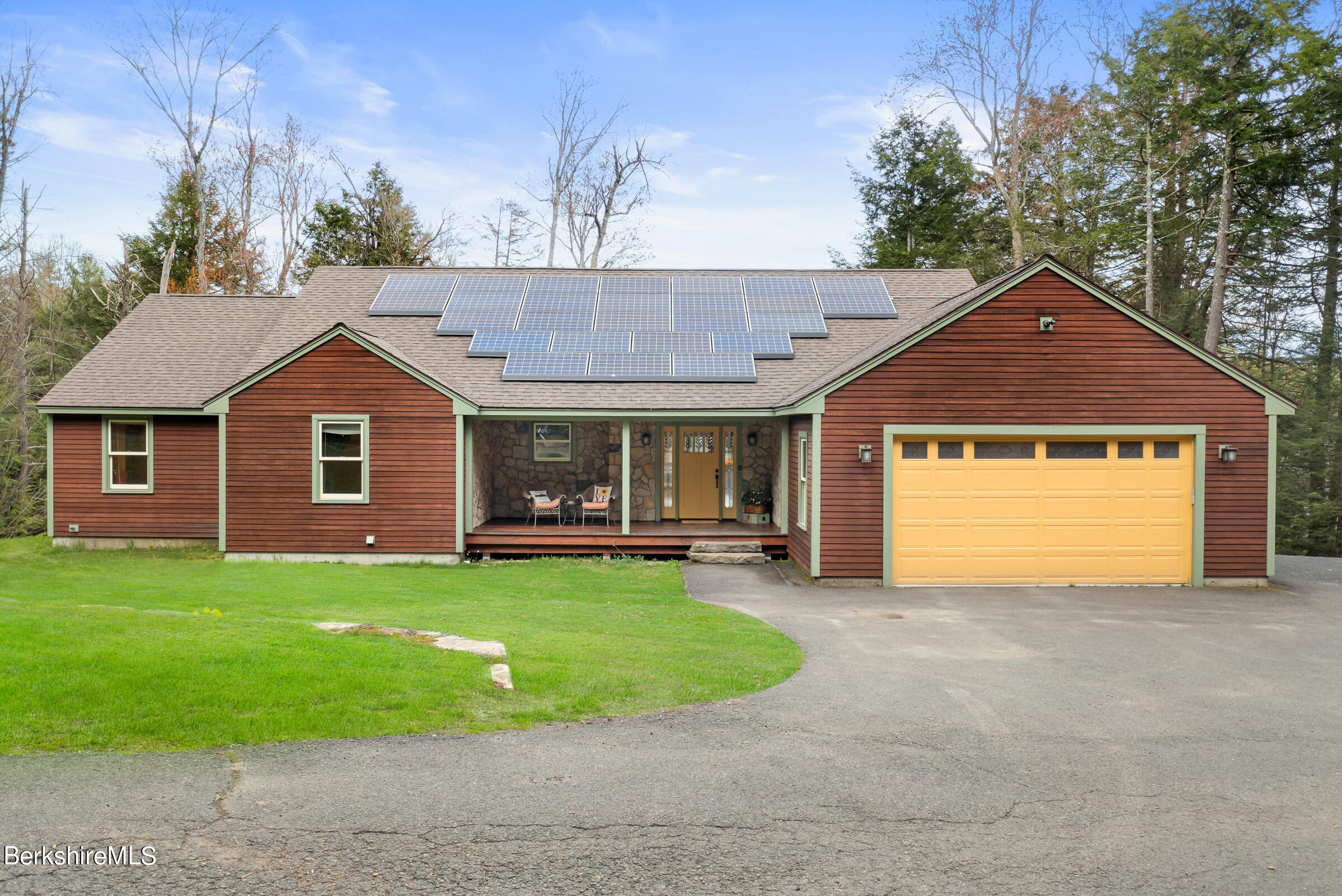 10 Antin Road Chesterfield, MA 01012 - Photo 33 of 36 a front view of a house with yard and garage