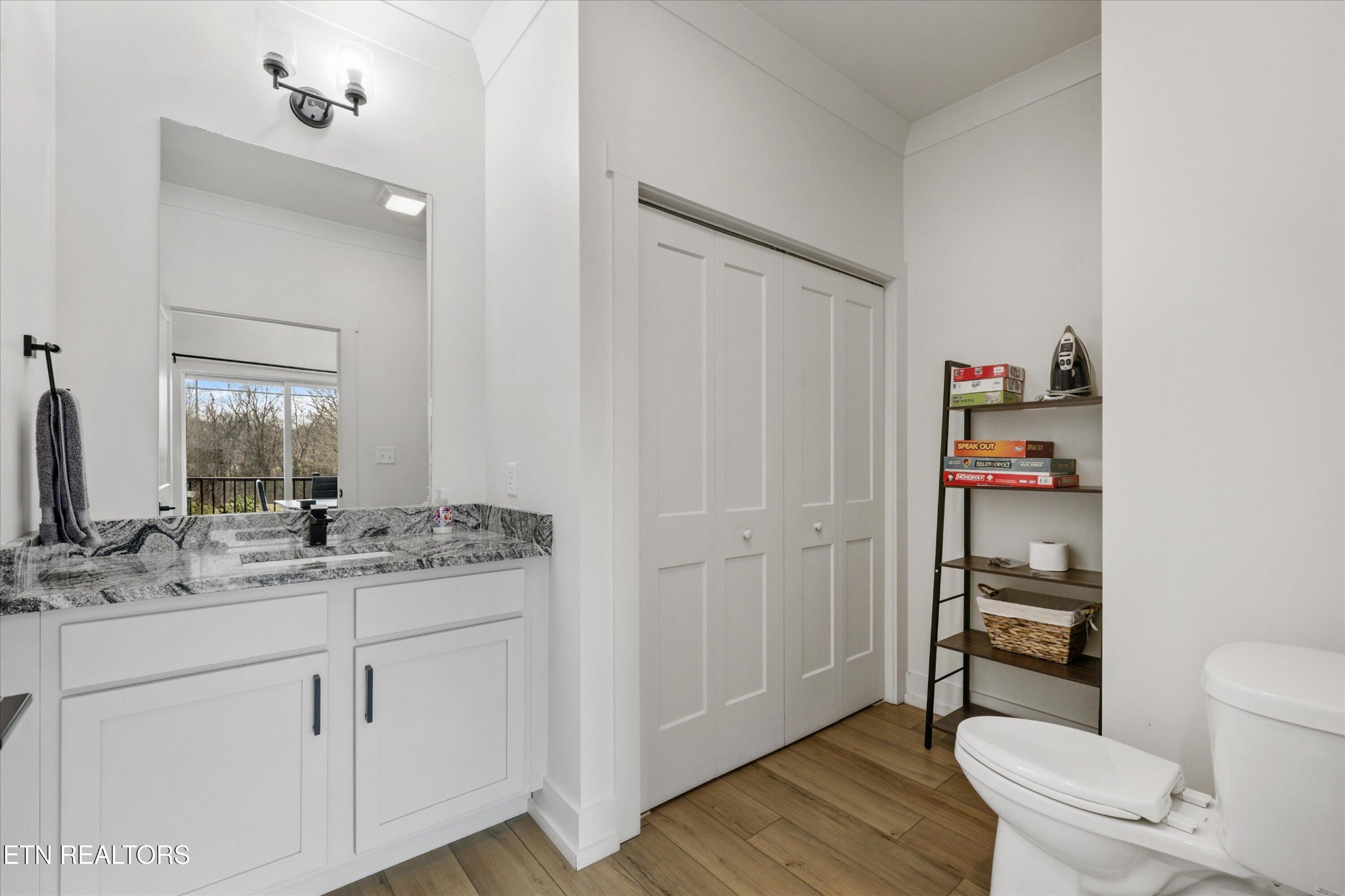 418 Fleeta Williams Way Sevierville, TN 37862 - Photo 13 of 39 a bathroom with a granite countertop toilet sink and a mirror