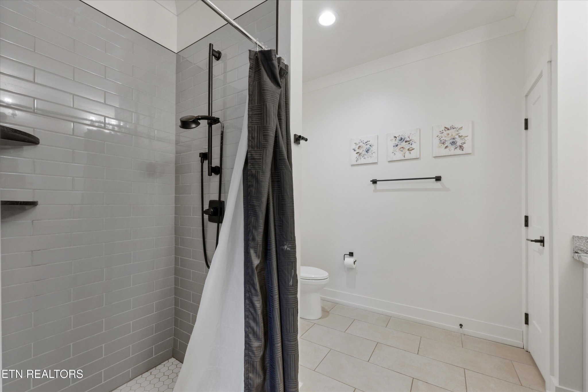418 Fleeta Williams Way Sevierville, TN 37862 - Photo 15 of 39 a bathroom with a shower and a glass door