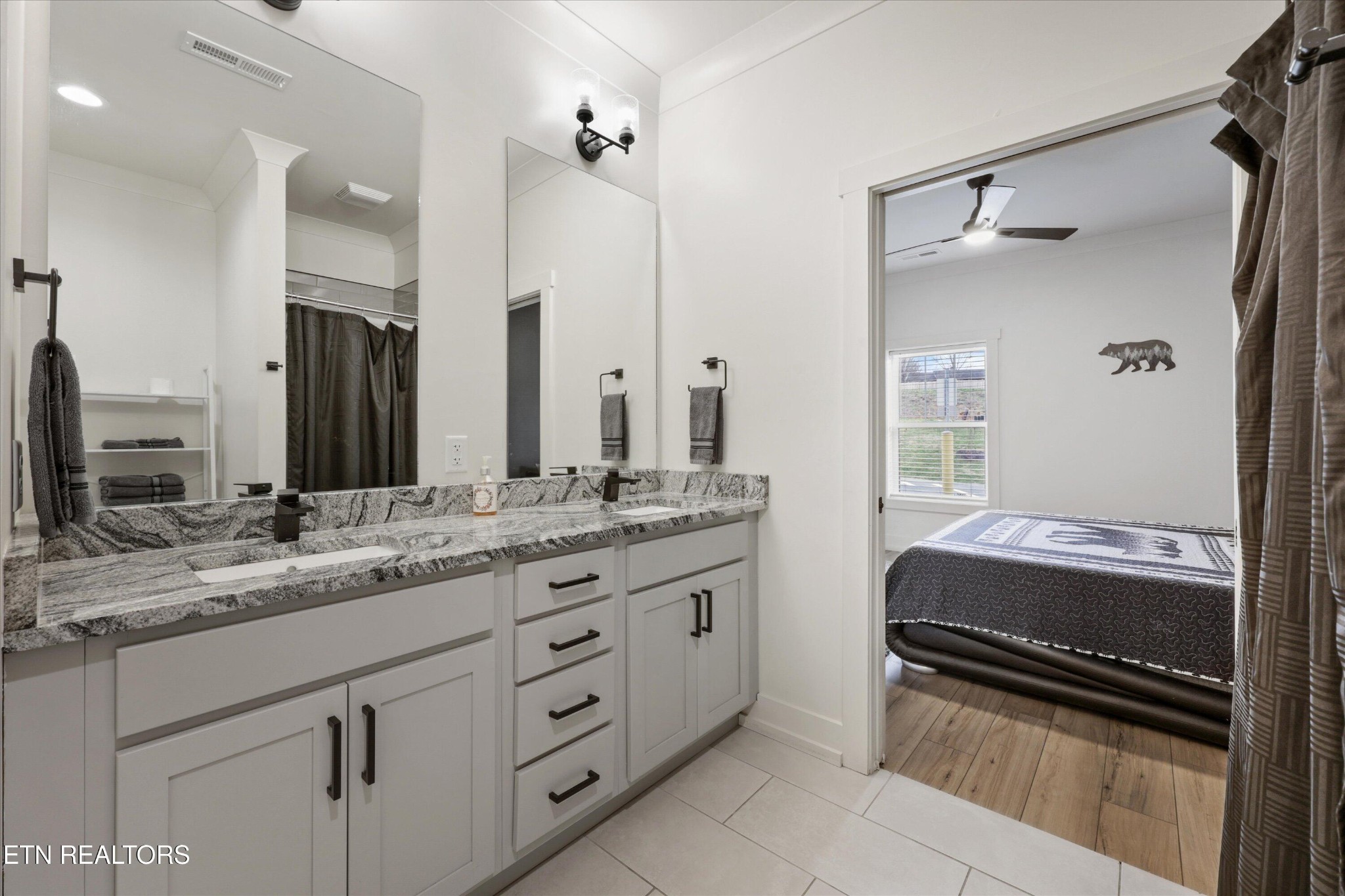 418 Fleeta Williams Way Sevierville, TN 37862 - Photo 16 of 39 a bathroom with a sink double vanity and a mirror