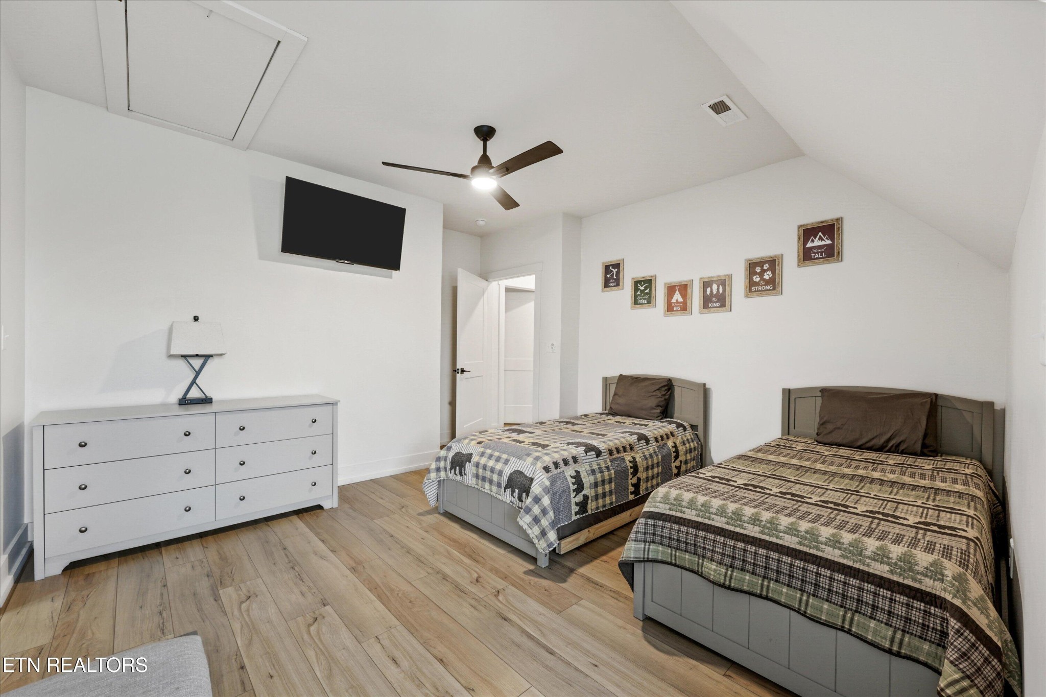 418 Fleeta Williams Way Sevierville, TN 37862 - Photo 18 of 39 a bedroom with two beds and a flat screen tv