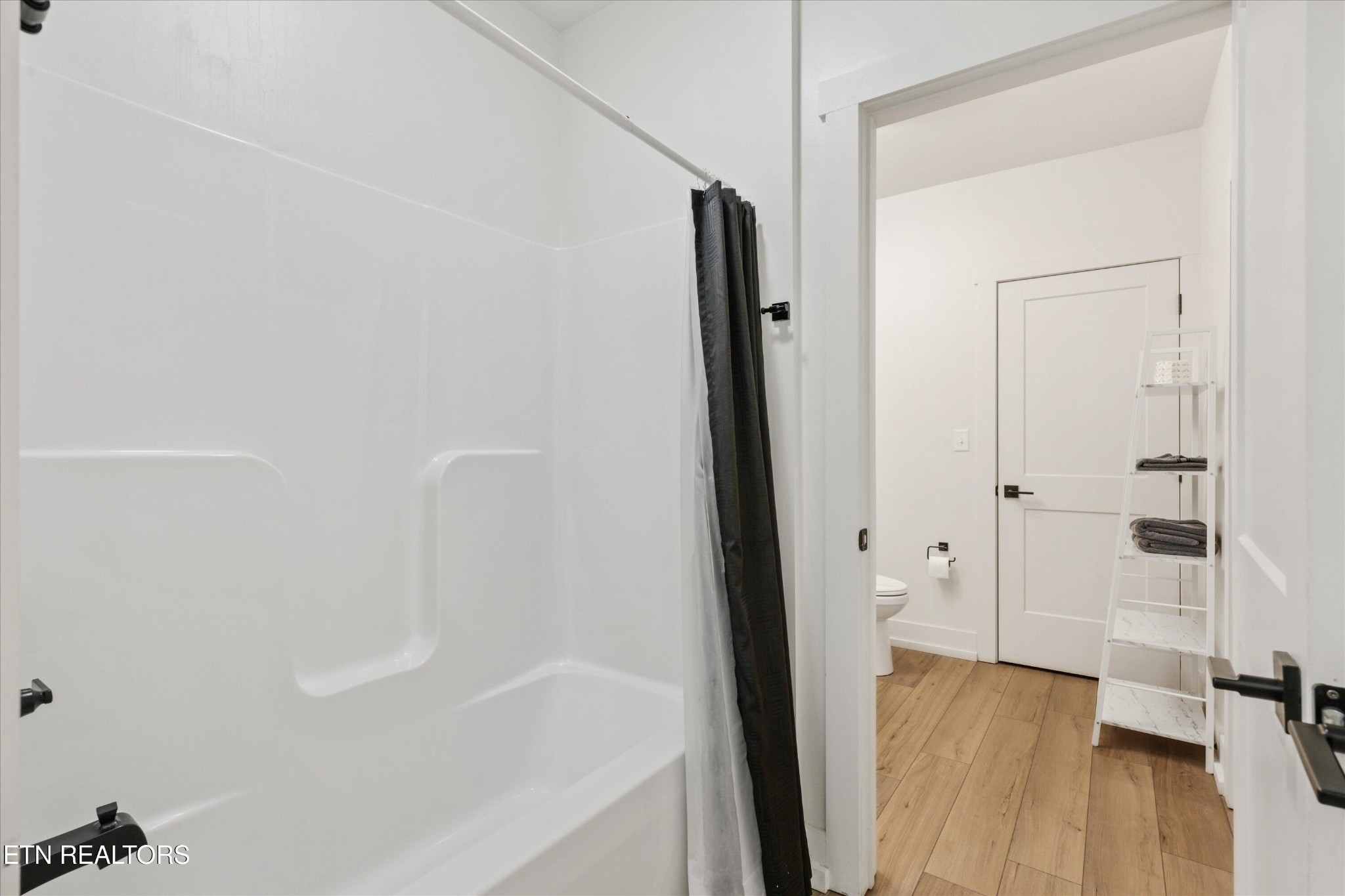 418 Fleeta Williams Way Sevierville, TN 37862 - Photo 20 of 39 a bathroom with a bathtub and a shower