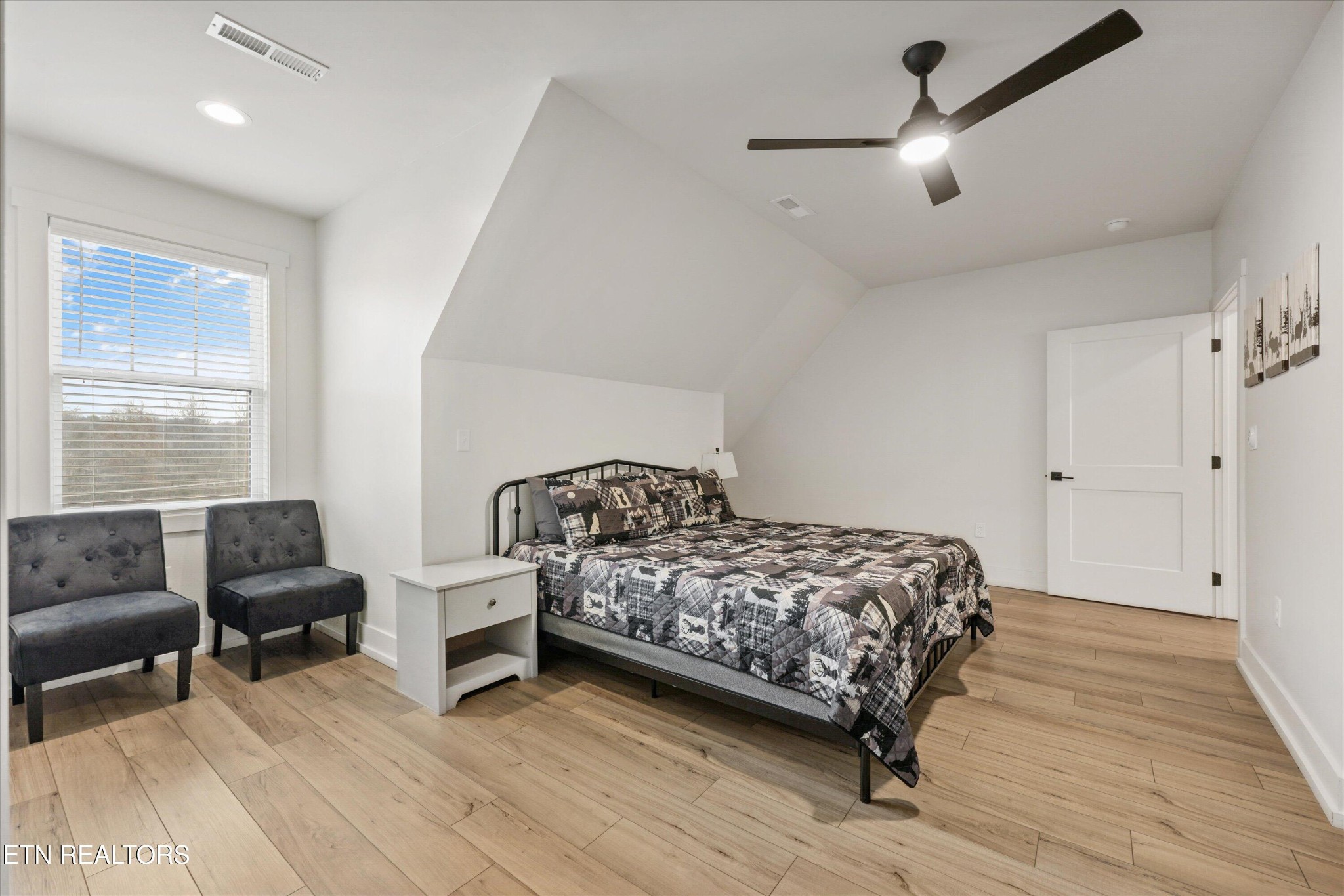418 Fleeta Williams Way Sevierville, TN 37862 - Photo 22 of 39 a bedroom with a bed and a couch