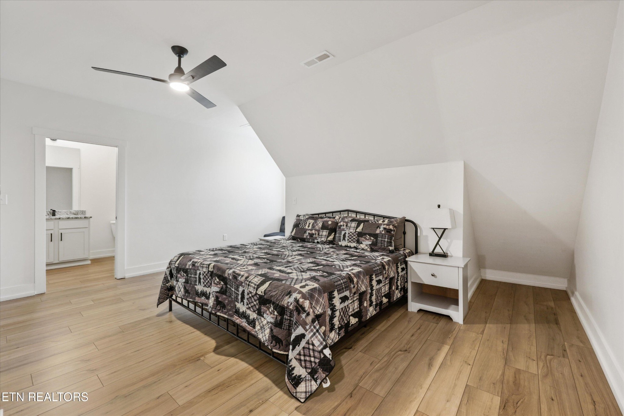 418 Fleeta Williams Way Sevierville, TN 37862 - Photo 23 of 39 a bedroom with a bed and a table
