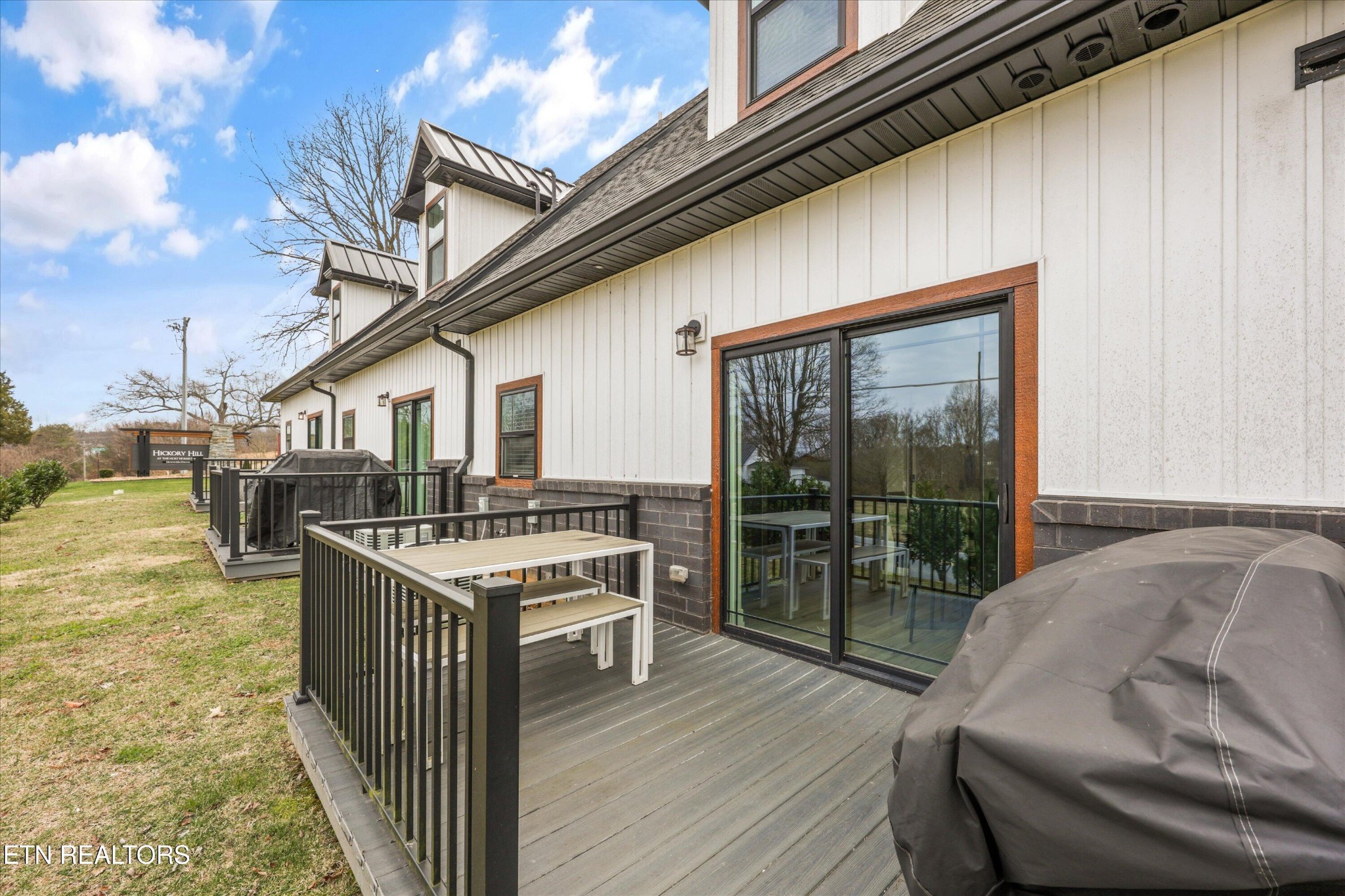 418 Fleeta Williams Way Sevierville, TN 37862 - Photo 24 of 39 a balcony with furniture and a floor to ceiling window