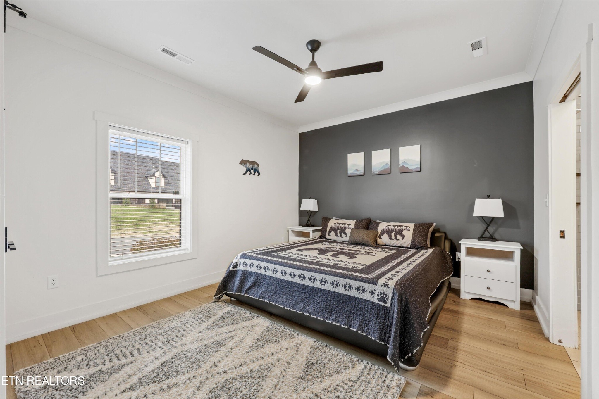418 Fleeta Williams Way Sevierville, TN 37862 - Photo 5 of 39 a bed sitting in a bedroom next to a window