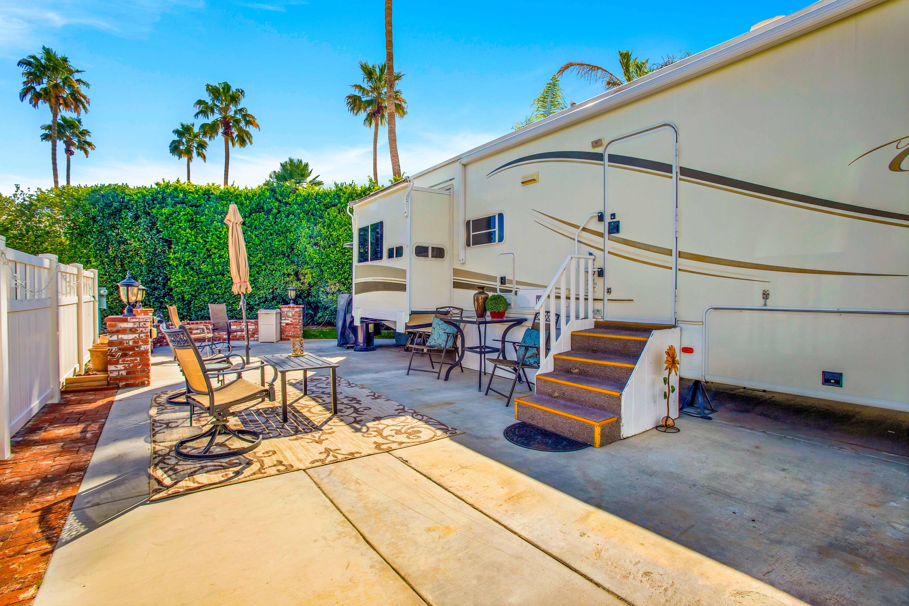 69411 Ramon Road, Unit 463 Cathedral City, CA 92234 - Photo 11 of 52 a view of a patio with a table and chairs