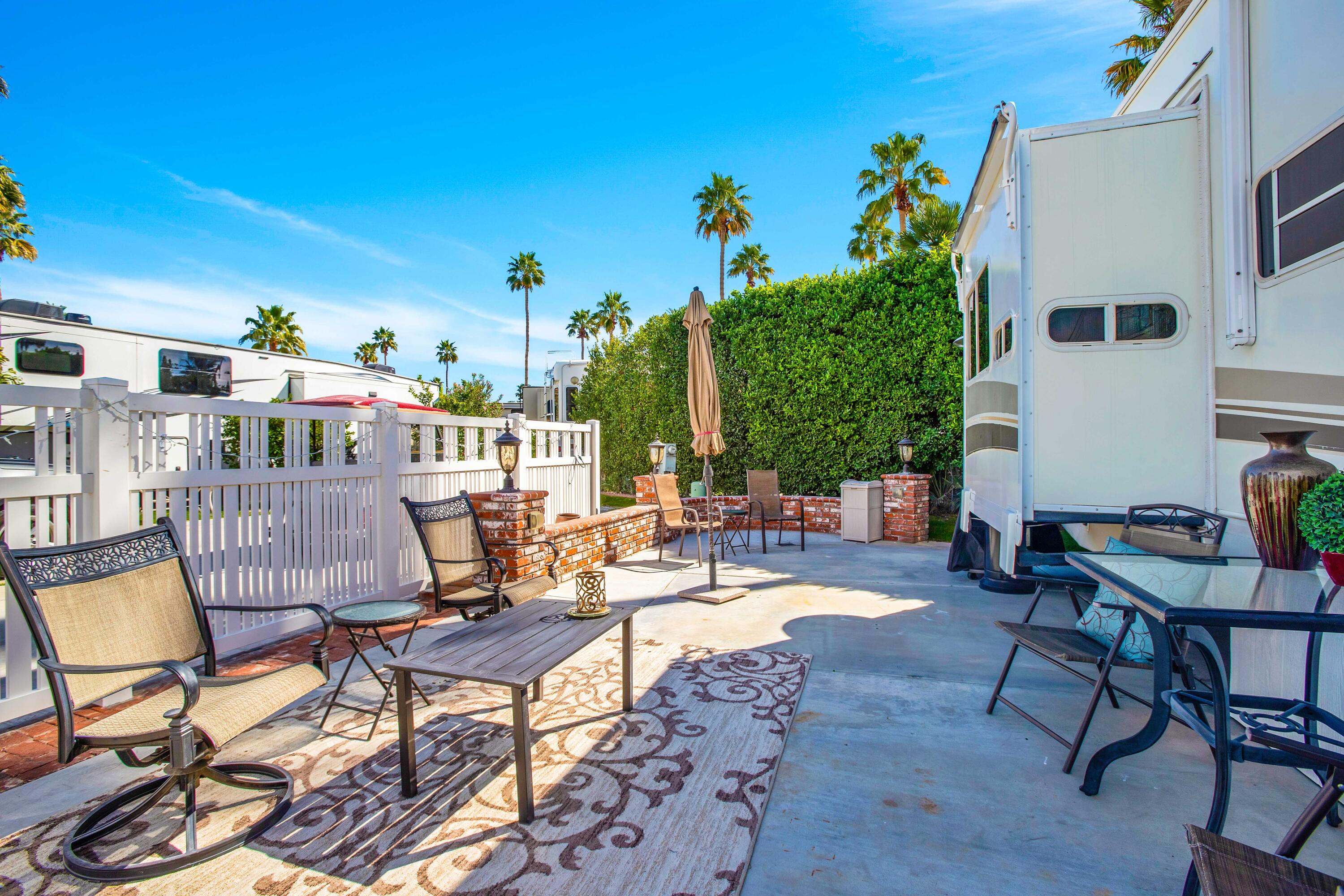 69411 Ramon Road, Unit 463 Cathedral City, CA 92234 - Photo 12 of 52 a view of a chairs and table in a patio