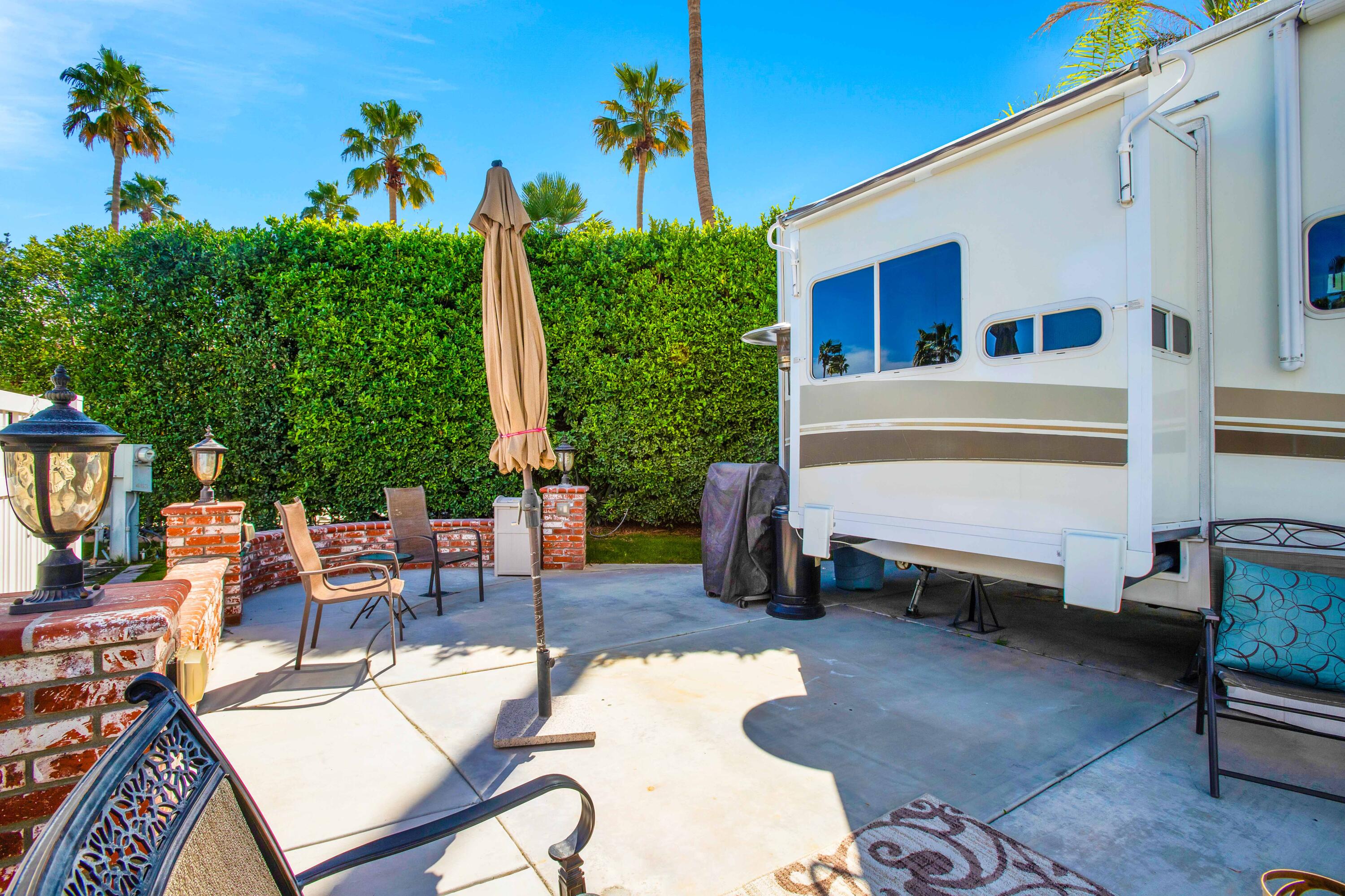 69411 Ramon Road, Unit 463 Cathedral City, CA 92234 - Photo 13 of 52 a view of a chairs and table in the patio