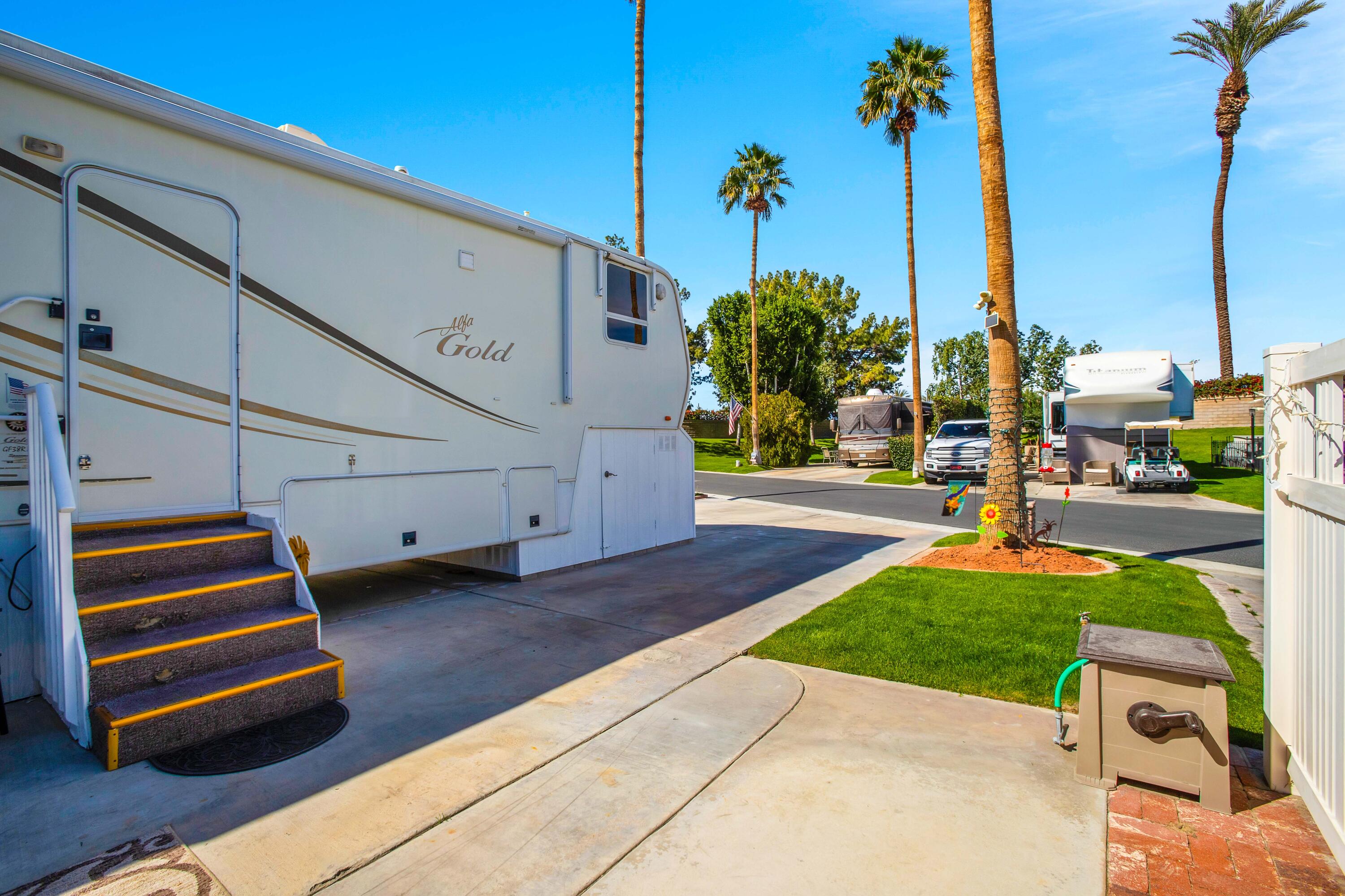 69411 Ramon Road, Unit 463 Cathedral City, CA 92234 - Photo 14 of 52 a front view of a building with garden
