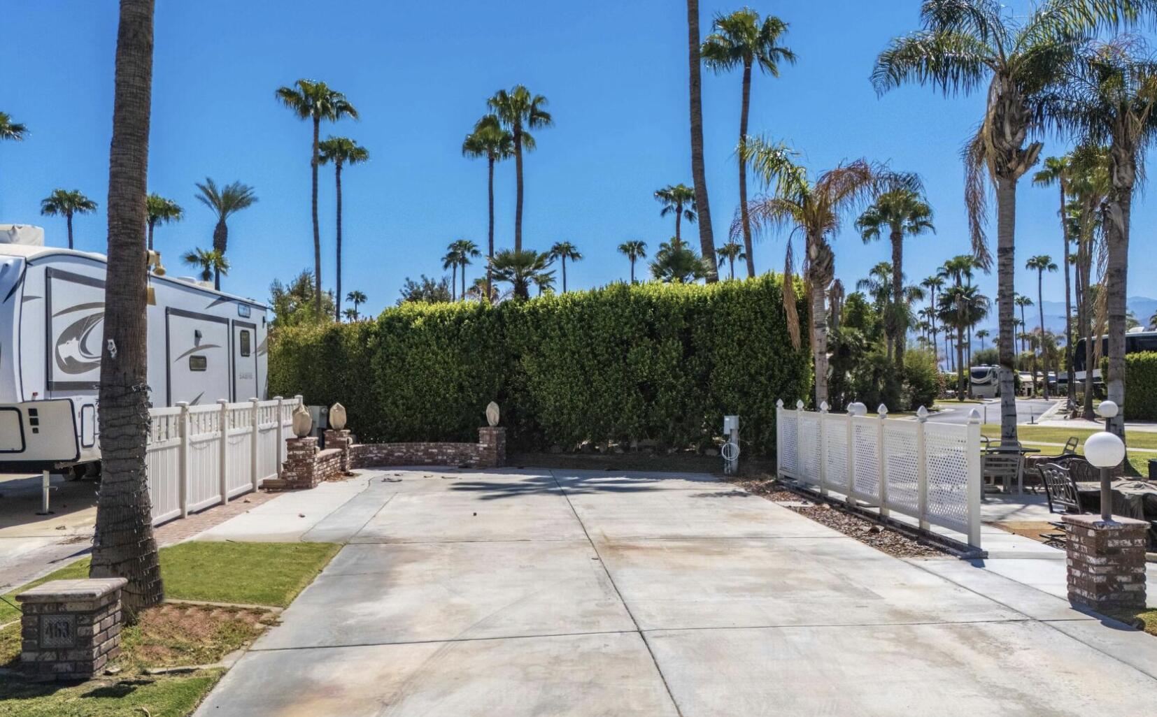 69411 Ramon Road, Unit 463 Cathedral City, CA 92234 - Photo 2 of 52 a view of a park with a yard and palm trees