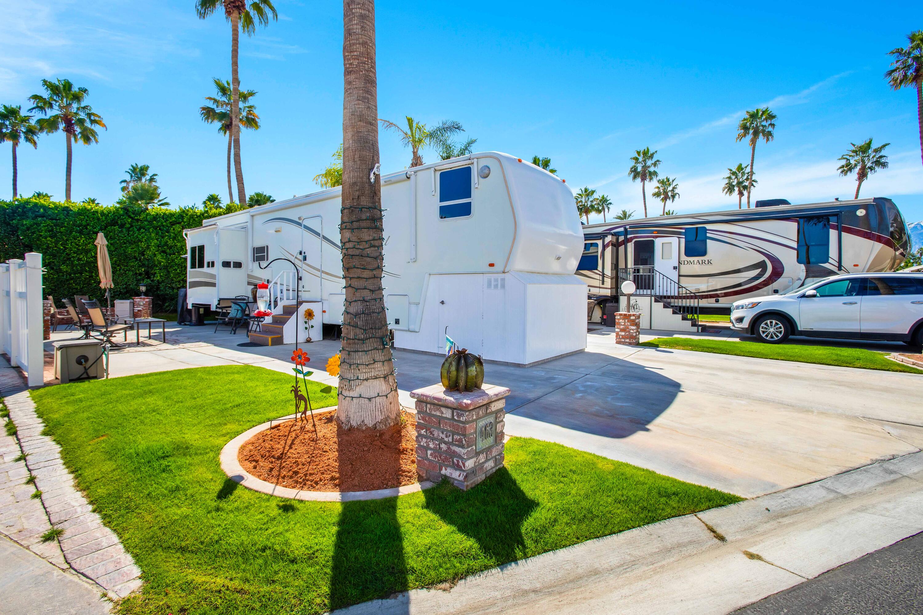 69411 Ramon Road, Unit 463 Cathedral City, CA 92234 - Photo 5 of 52 a swimming pool with outdoor seating and yard