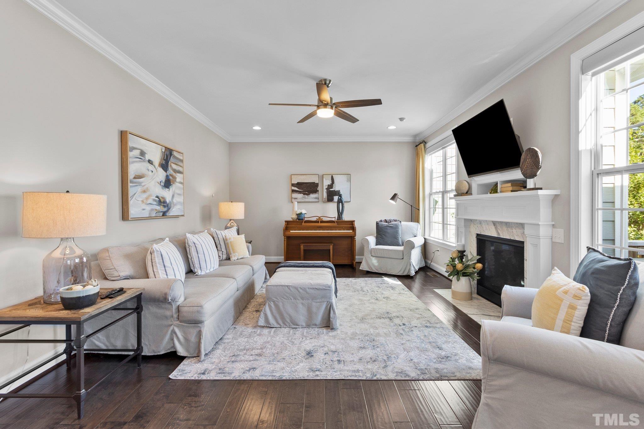 2830 Riley's Pond Drive Apex, NC 27502 - Photo 13 of 54 a living room with furniture fireplace and flat screen tv