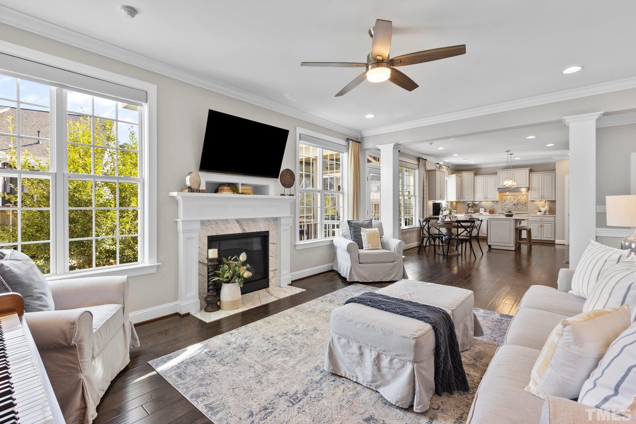 2830 Riley's Pond Drive Apex, NC 27502 - Photo 18 of 54 a living room with furniture fireplace and flat screen tv