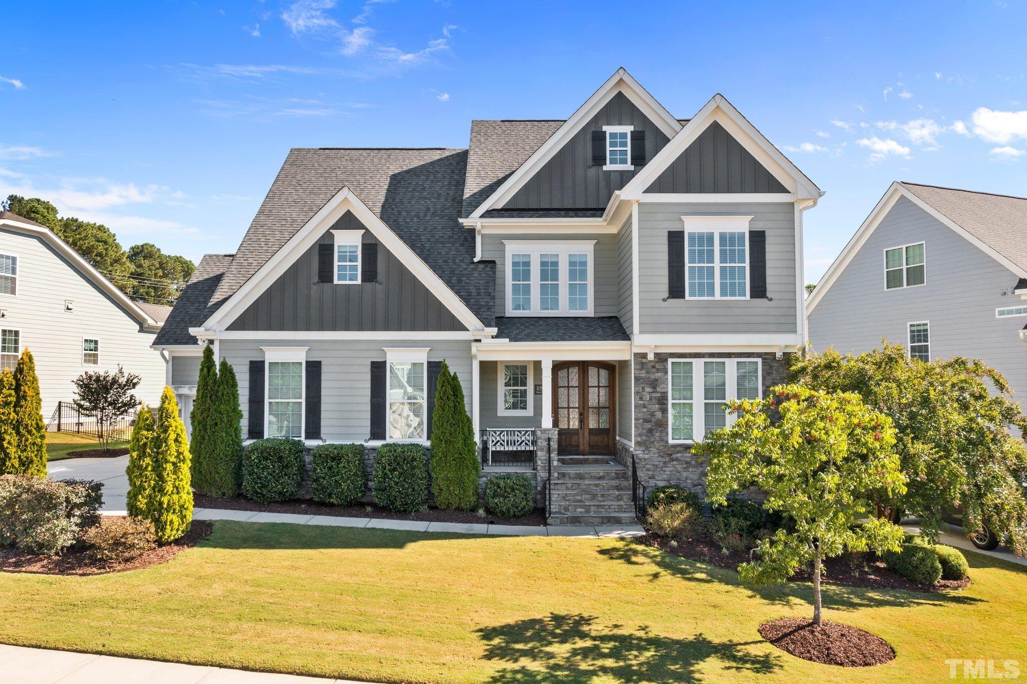 2830 Riley's Pond Drive Apex, NC 27502 - Photo 2 of 54 a front view of a house with a yard
