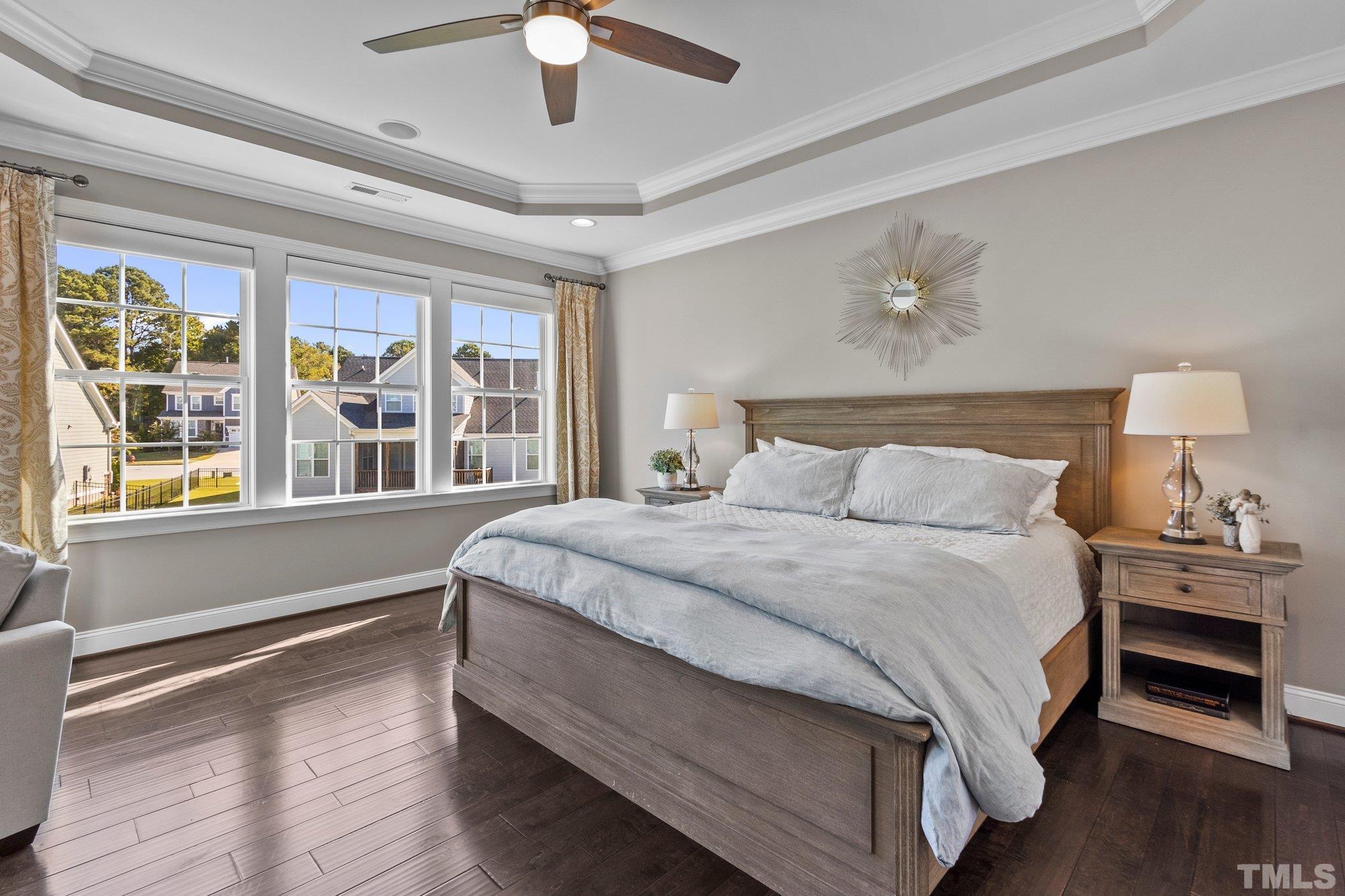 2830 Riley's Pond Drive Apex, NC 27502 - Photo 21 of 54 a bedroom with a large bed and a window