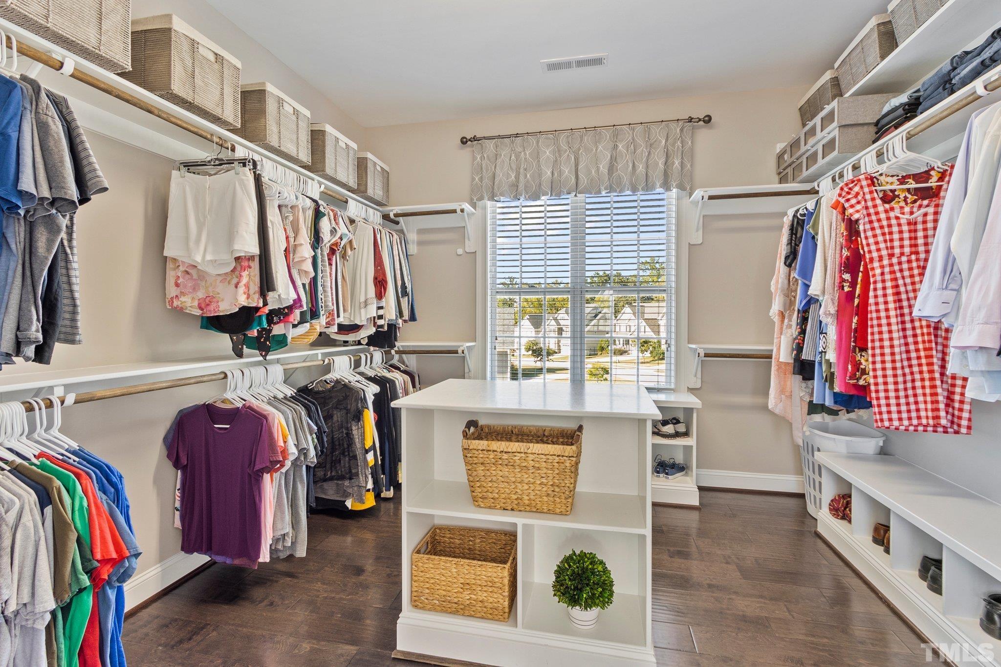 2830 Riley's Pond Drive Apex, NC 27502 - Photo 24 of 54 a view of walk in closet with clothes and shoes