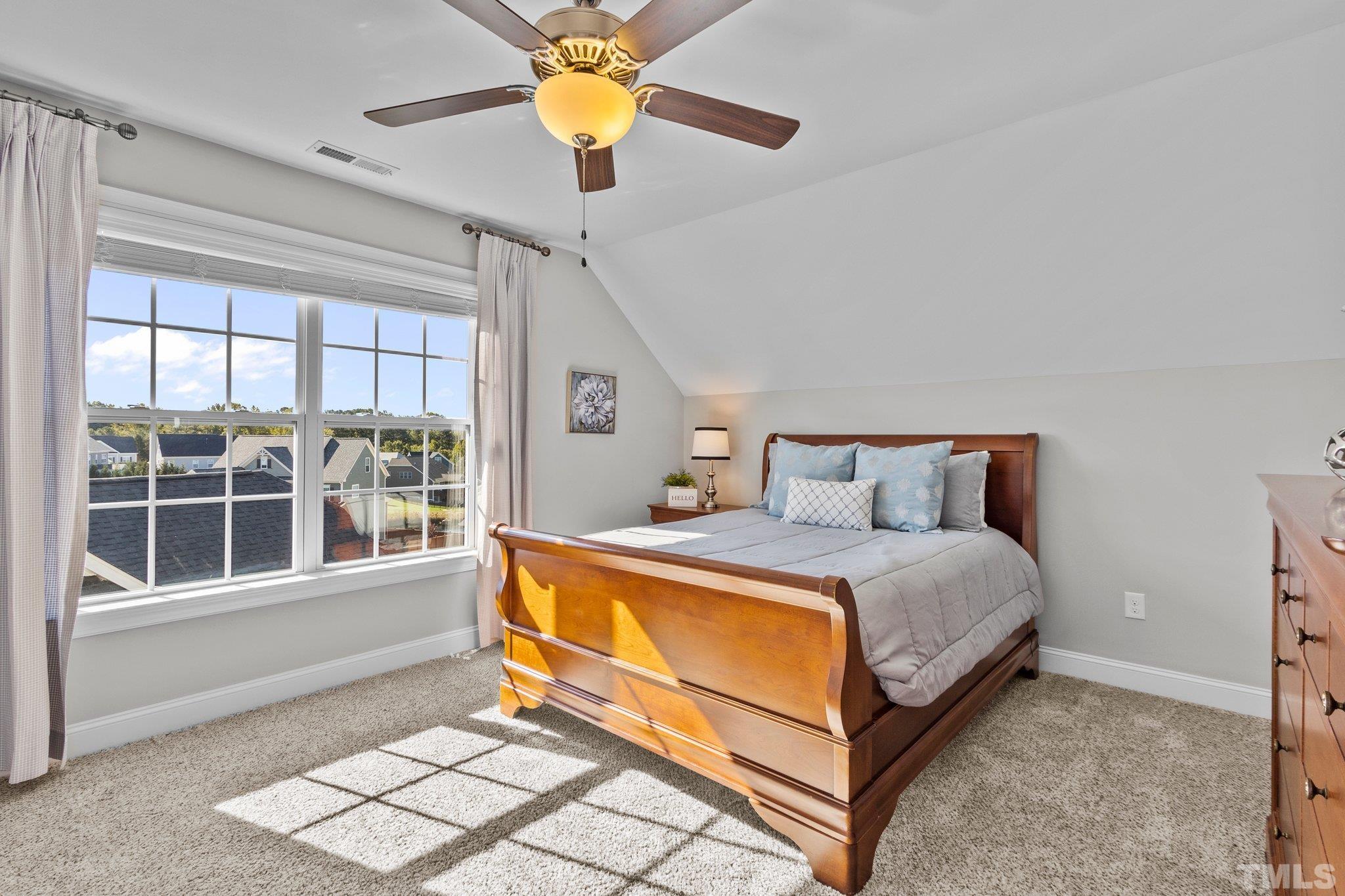 2830 Riley's Pond Drive Apex, NC 27502 - Photo 33 of 54 a bed room with a bed and a window