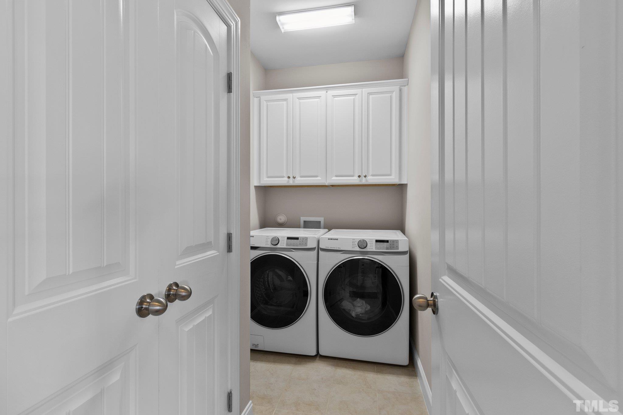 2830 Riley's Pond Drive Apex, NC 27502 - Photo 36 of 54 a utility room with dryer and washer