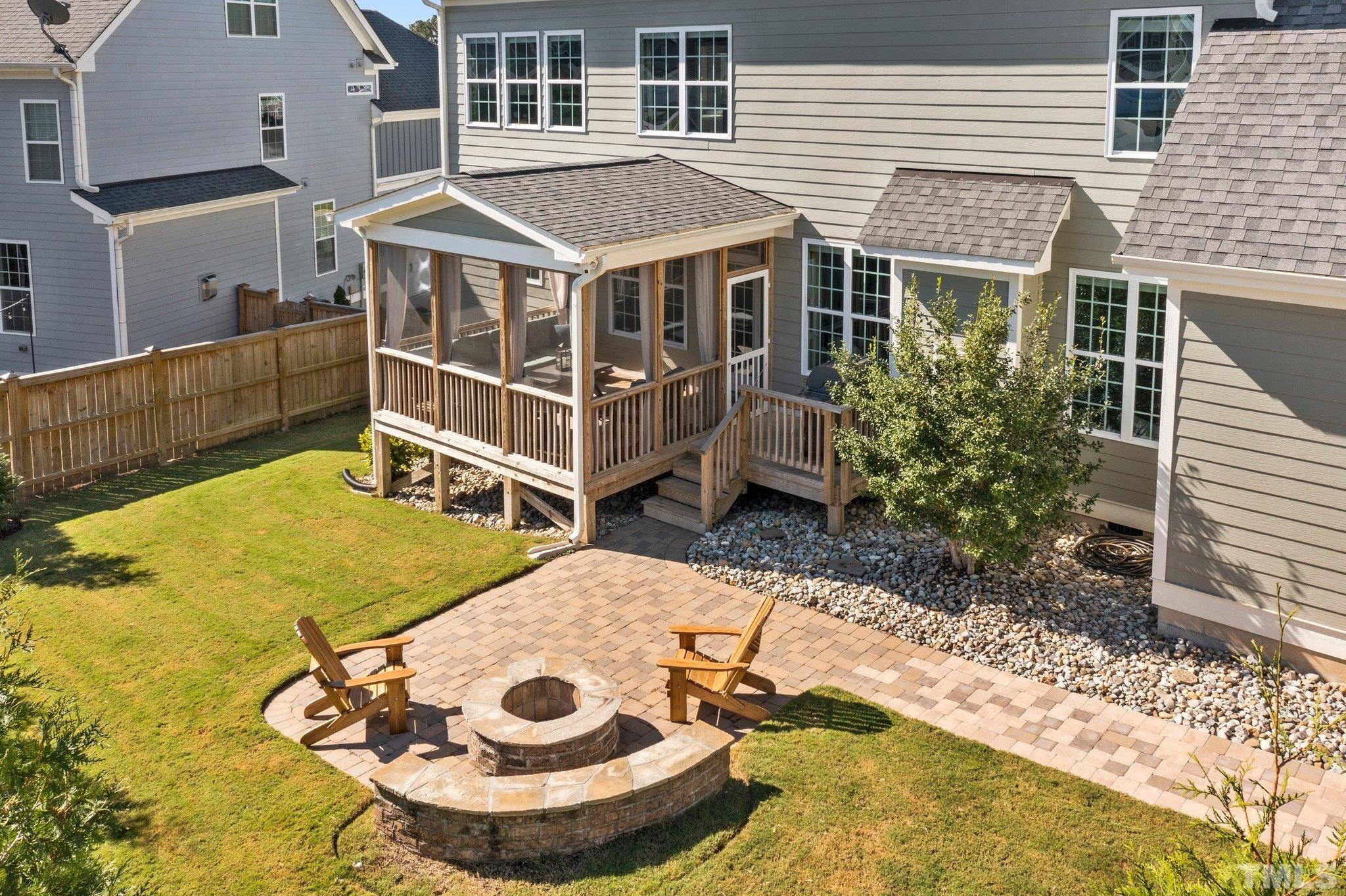 2830 Riley's Pond Drive Apex, NC 27502 - Photo 4 of 54 a view of a house with pool and chairs