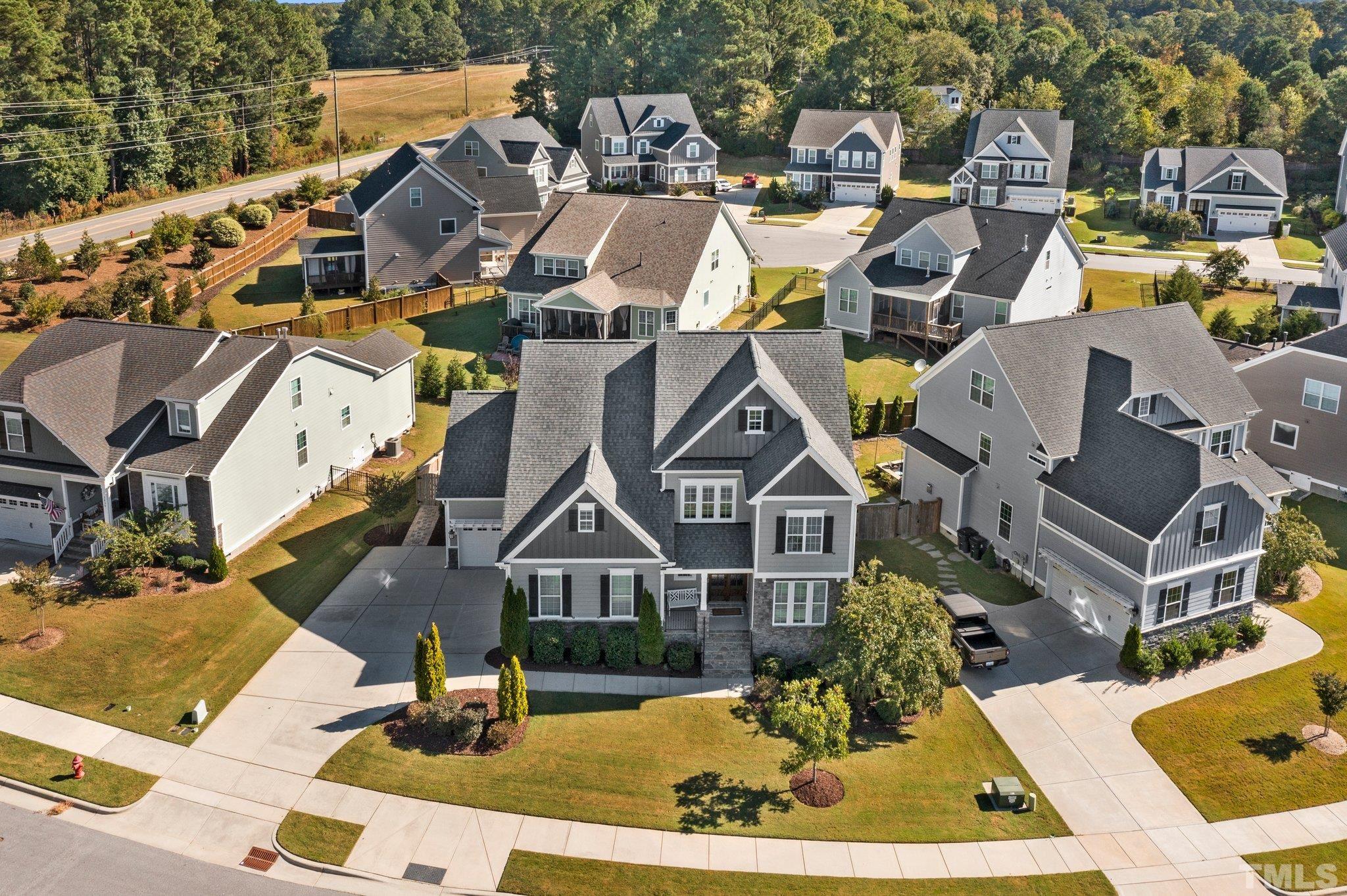 2830 Riley's Pond Drive Apex, NC 27502 - Photo 42 of 54 an aerial view of a house with a swimming pool