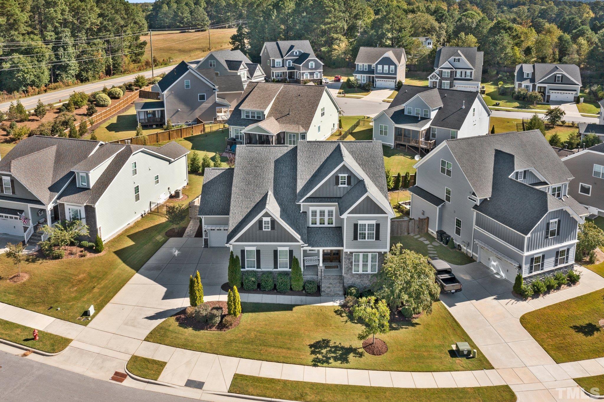 2830 Riley's Pond Drive Apex, NC 27502 - Photo 51 of 54 a aerial view of a house with swimming pool and ocean view