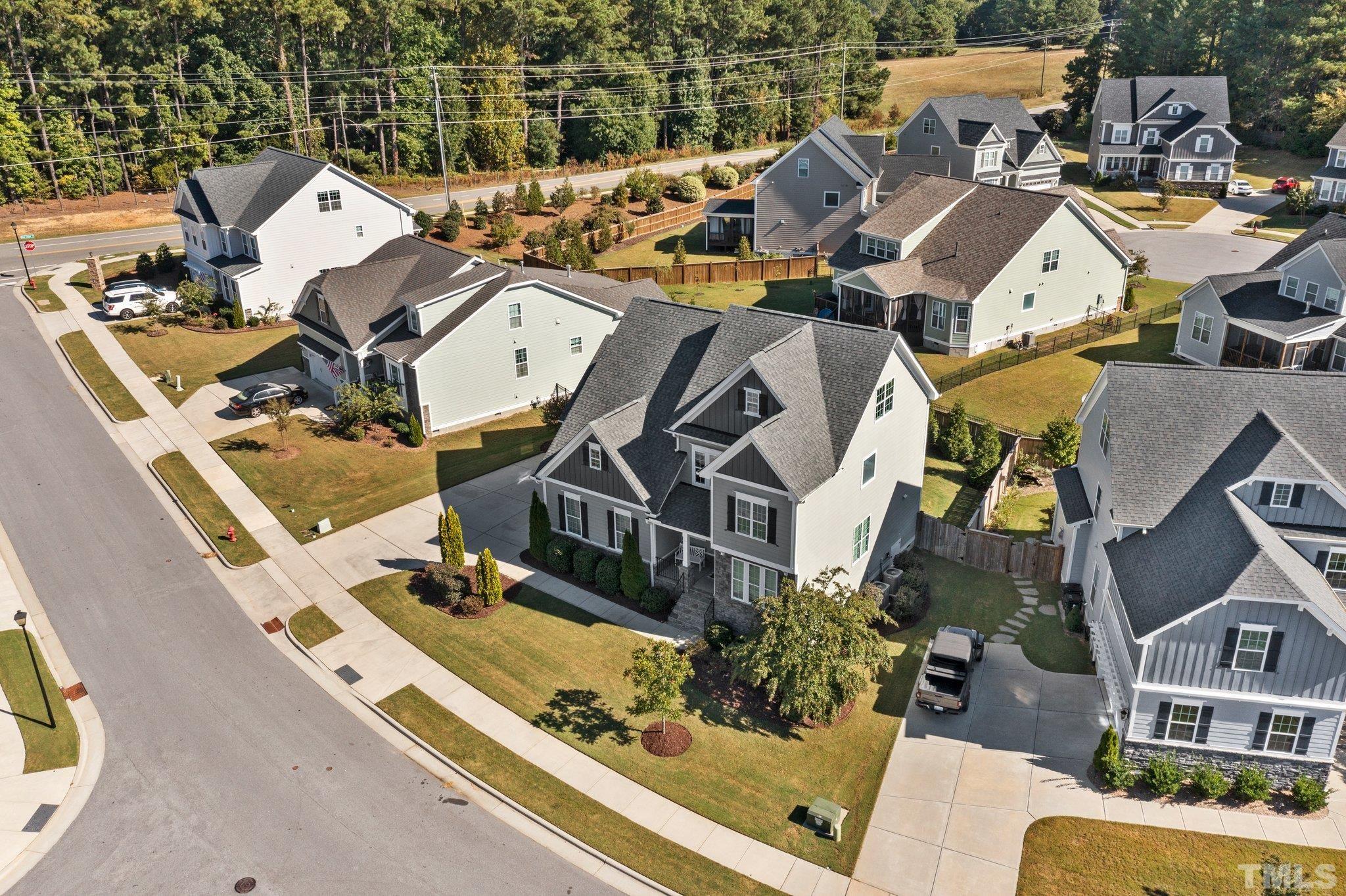 2830 Riley's Pond Drive Apex, NC 27502 - Photo 52 of 54 an aerial view of a house with a large trees