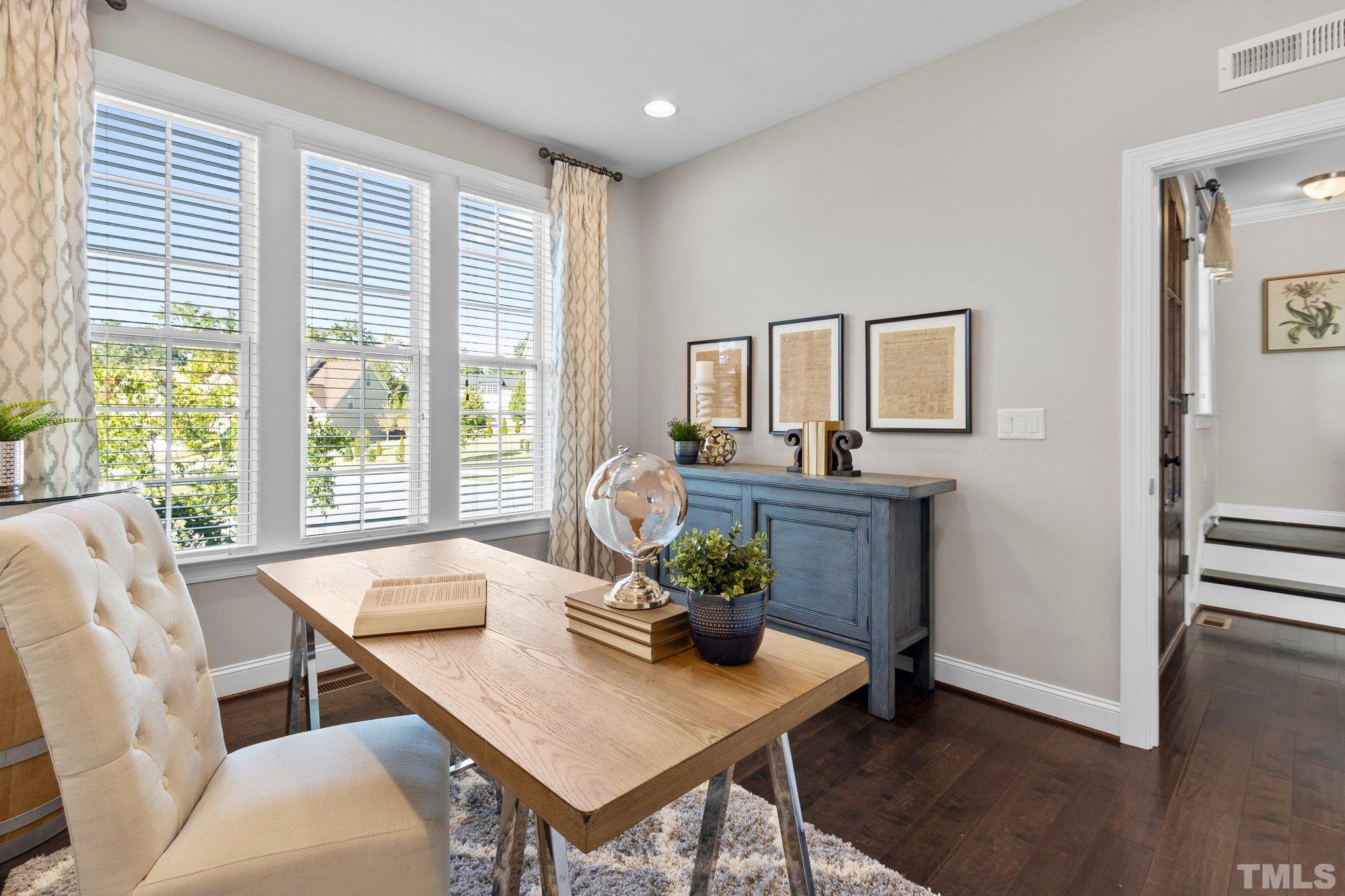 2830 Riley's Pond Drive Apex, NC 27502 - Photo 53 of 54 a view of a dining room with furniture window and wooden floor