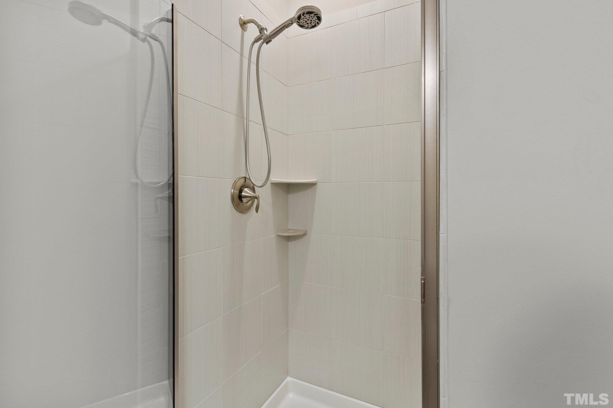 2830 Riley's Pond Drive Apex, NC 27502 - Photo 54 of 54 a bathroom with a shower