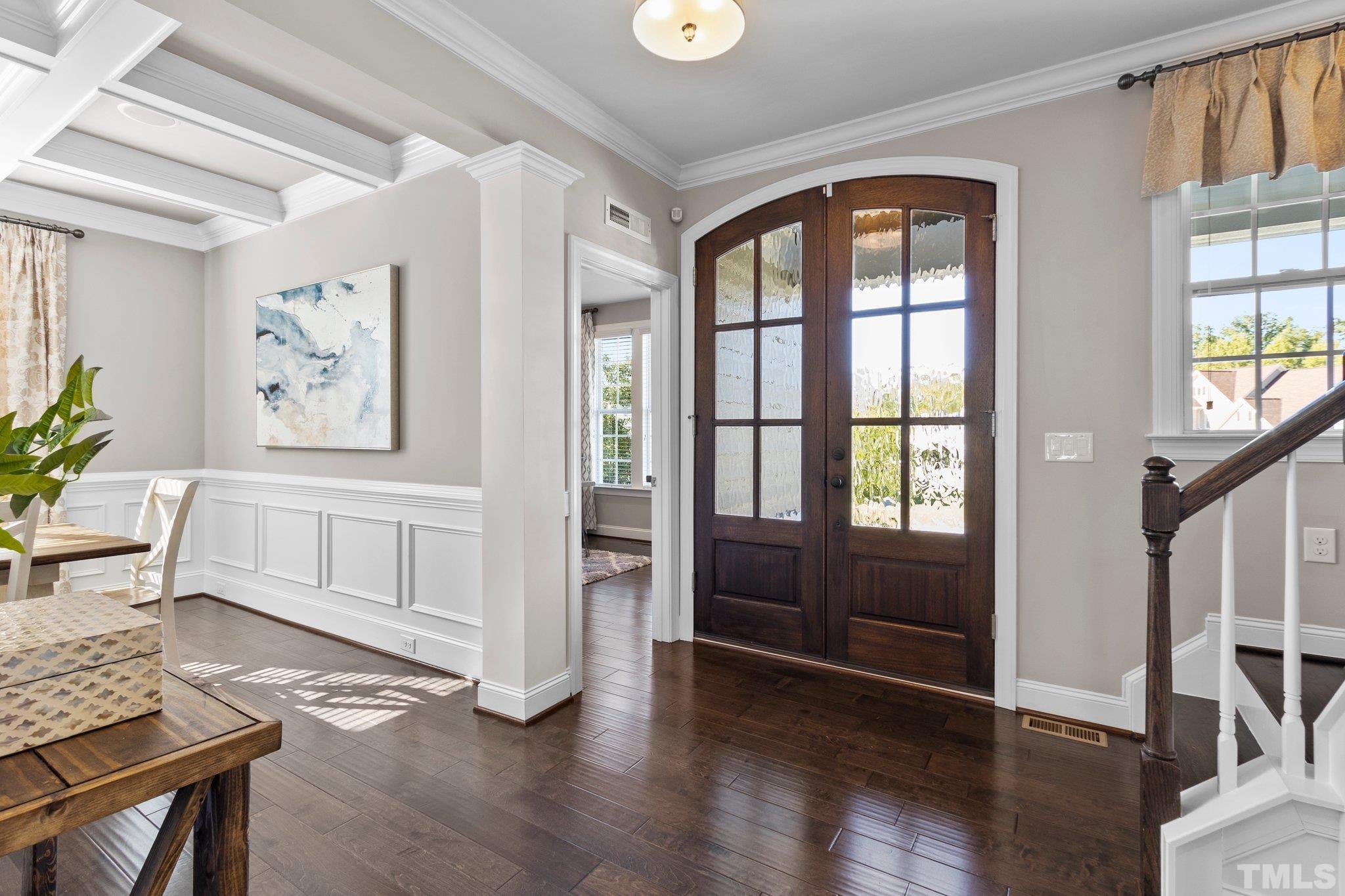 2830 Riley's Pond Drive Apex, NC 27502 - Photo 7 of 54 a view of an entryway with wooden floor and windows