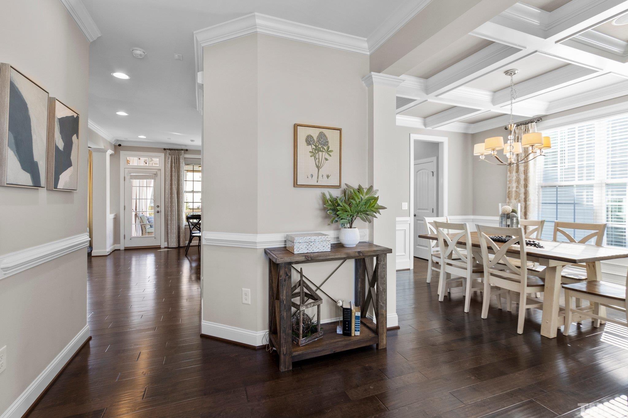 2830 Riley's Pond Drive Apex, NC 27502 - Photo 9 of 54 a view of a dining room with furniture and wooden floor