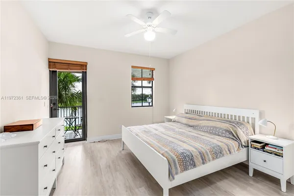 a bedroom with a bed and a window with view of bedroom