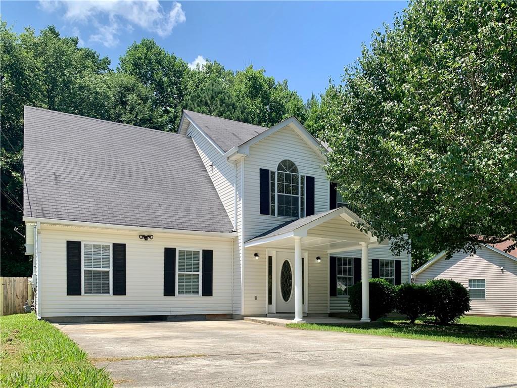 3581 6 Oaks Court Decatur, GA 30034 - Photo 1 of 1 a view of a white house with a plants and large trees