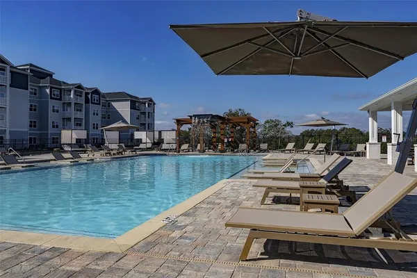 a view of a swimming pool with a patio