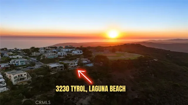 a view of a balcony with two chairs and a potted plant