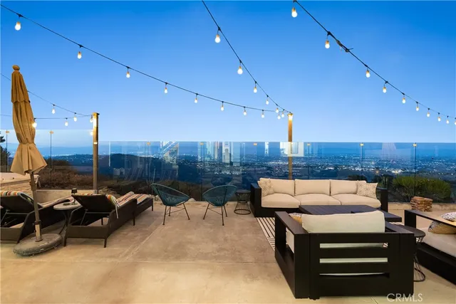 a living room with fireplace furniture and a flat screen tv