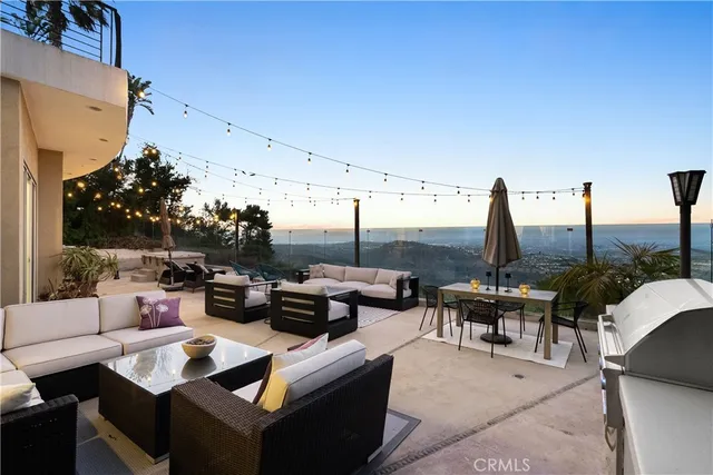 a bedroom with a bed and large windows