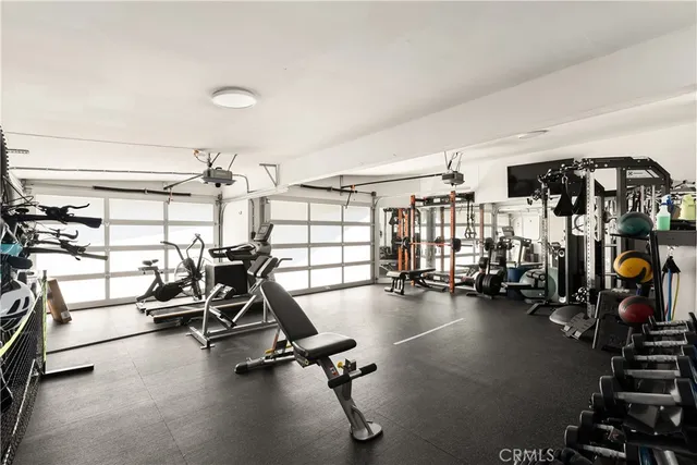 a bedroom with a large bed and a large window