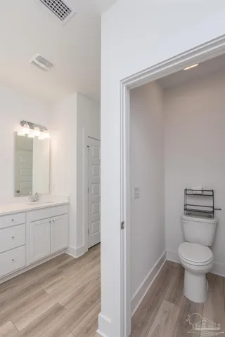 a bathroom with a toilet sink and tub