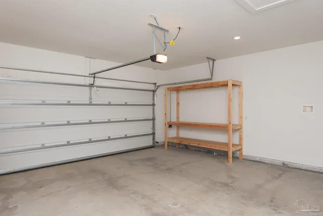 a view of room that has a bed and a ceiling fan