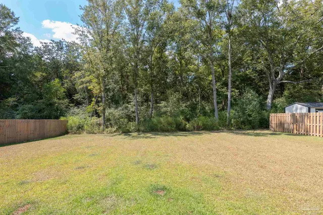 a view of swimming pool with a yard